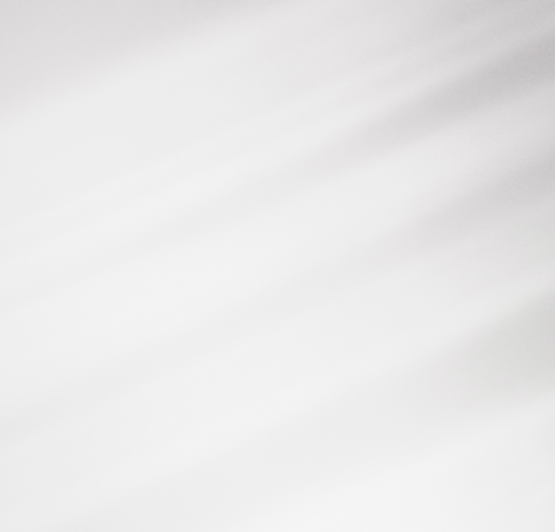Abstract gray and white textured background image.