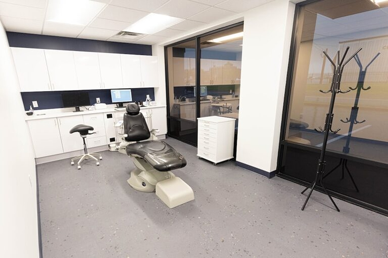 Modern dental clinic interior with treatment chair.