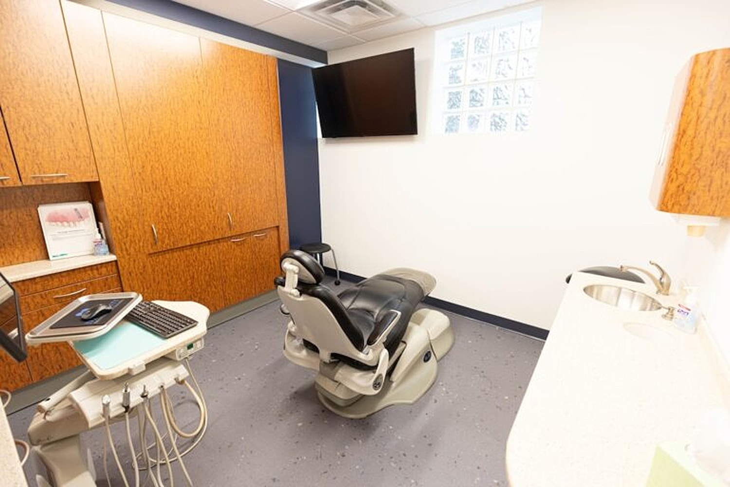 Dental office with chair and equipment.