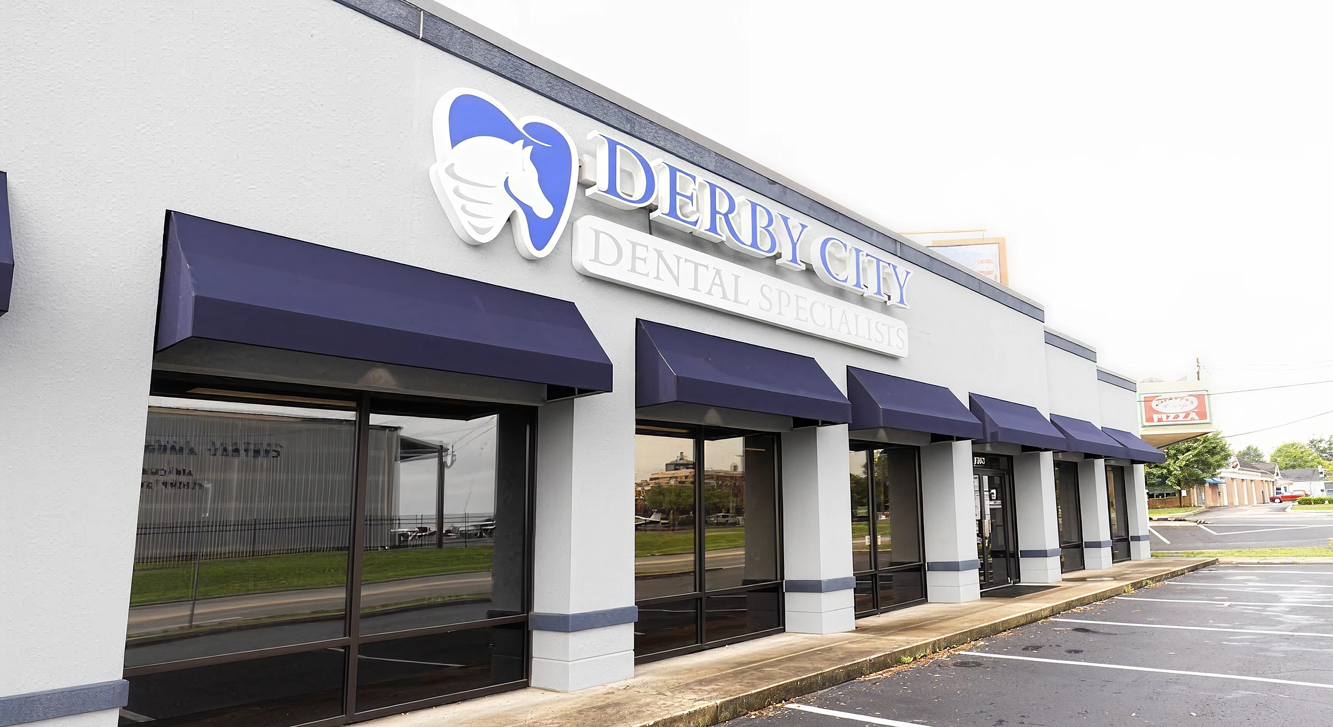 Dental office exterior with Derby City signage.