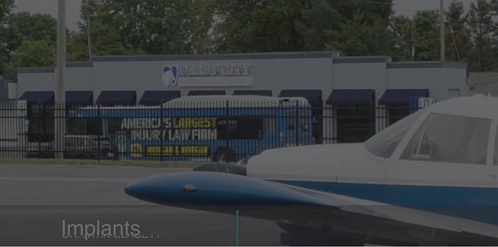 Dental clinic and airplane in urban setting.